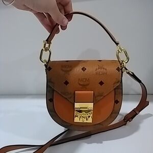 A crossbody and small hand bag, MCM, luggage color